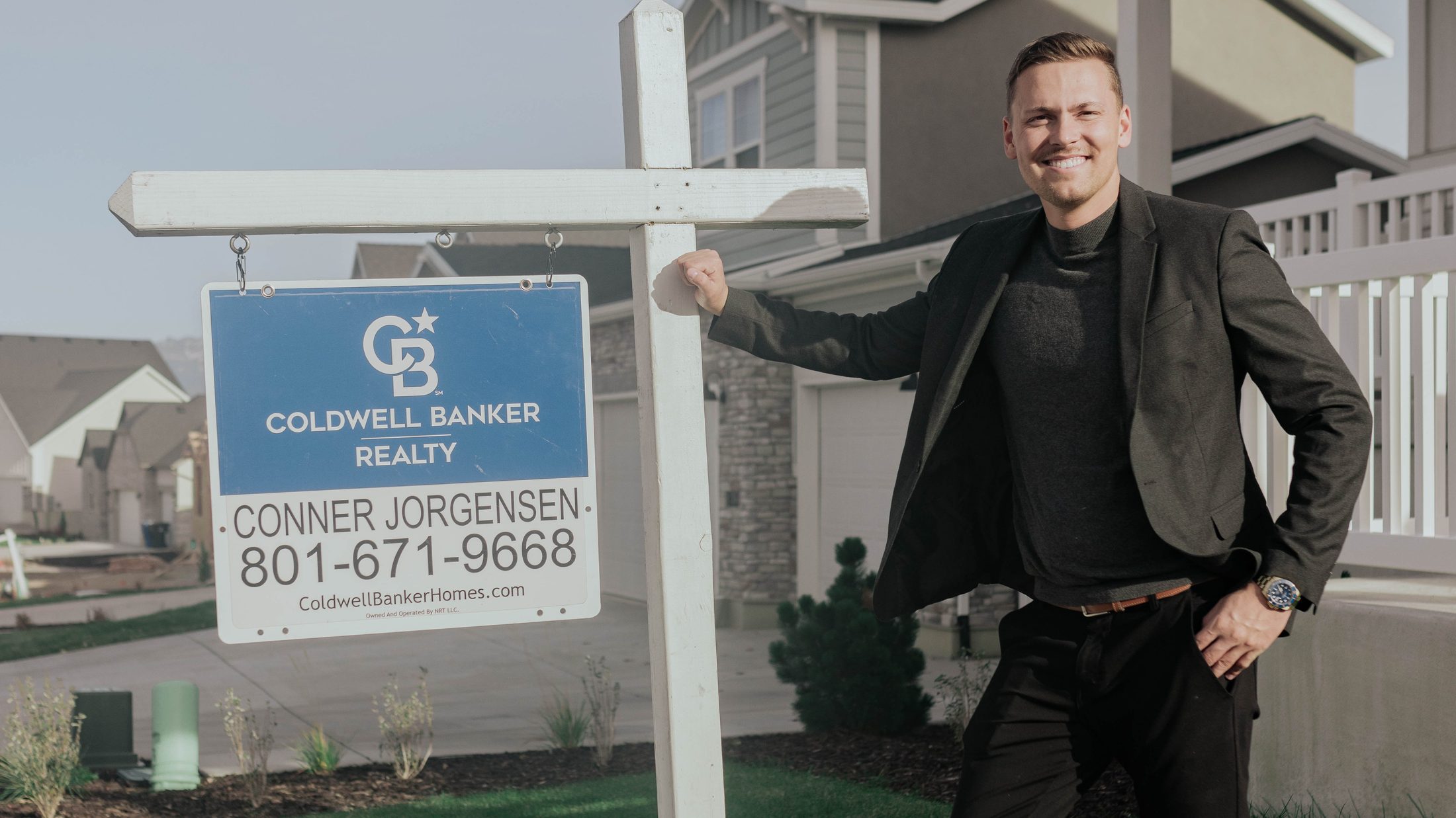 Conner Jorgensen in front of a Utah home prepared for its listing launch
