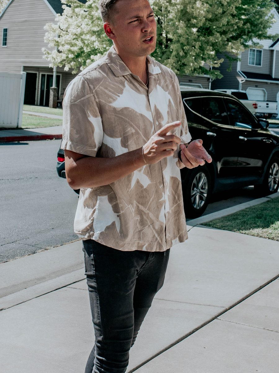 Conner mid-conversation while touring a Utah neighborhood with buyers